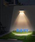 Heavy Duty Solar Wall Lights Outdoor Waterproof For Fence Or Mailbox Or Address Sign Offering Three Light Modes With Warm Daylight And Cool White Colors Using Wide Angle Focus Lens Delivering Kickass Yard Illumination illuminating grass marked 6.6 FT at night.