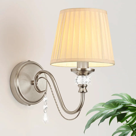 1-Light Brushed Nickel Vanity Light with Beige Fabric, Modern Wall Sconce, showcasing a curved arm and decorative crystals.