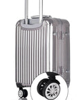 Swivel Replacement Luggage Wheel Set Two Pack 2.2 Inch Heavy Duty on silver suitcase, close-up