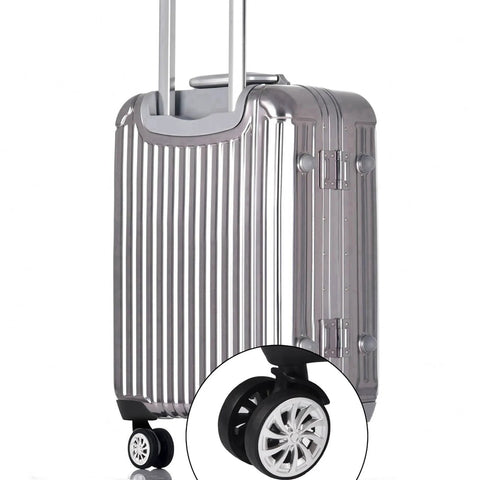 Swivel Replacement Luggage Wheel Set Two Pack 2.2 Inch Heavy Duty on silver suitcase, close-up