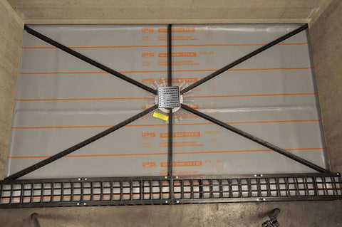 Shower Floor Slope Kit With Quick Pitch And Pre Pitch System, Universal Center Drain Ring, Weep Hole Protector installed in shower floor