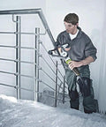 Man using Powerful 800W Electric Round Tube Polisher Sander Machine for stainless steel polishing on stair railing.