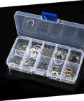 Open plastic case with 304 Stainless Steel C Shaped Retaining Clips Set 100 Pieces Split Washer Kit For M8 Axle Rings displayed on black background.