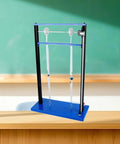 Vibration And Resonance Demonstrator For Physics Classrooms on wooden table, blue metal frame, pendulum model visible.
