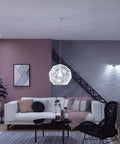 Modern living room with White Ambiance A19 LED Smart Bulb With 50,000 Tunable White Shades, pendant light over coffee table