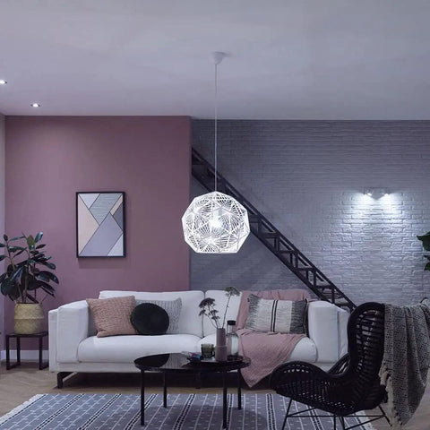 Modern living room with White Ambiance A19 LED Smart Bulb With 50,000 Tunable White Shades, pendant light over coffee table