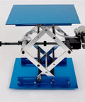 Industrial Grade Electric Scissor Lift Platform Featuring A Heavy Duty Hydraulic Table Built Tough For Massive Payloads and Hassle Free Material Transport Across Any Workspace, blue tabletop.