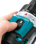 Hand adjusting the torque setting of the Top Shelf 18V Lithium Ion Brushless Drill Driver With Electric Brake Led Work Light And 21 Torque Settings.