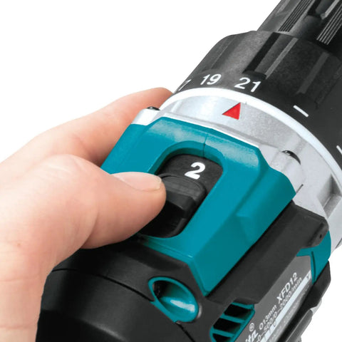 Hand adjusting the torque setting of the Top Shelf 18V Lithium Ion Brushless Drill Driver With Electric Brake Led Work Light And 21 Torque Settings.