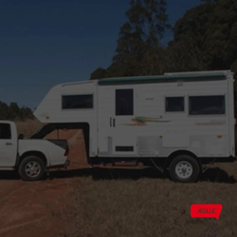 No Sweat Heavy Duty Trailer Axle Conversion And Lift Kit For 3500 Lb Trailers with trailer attached to truck outdoors.