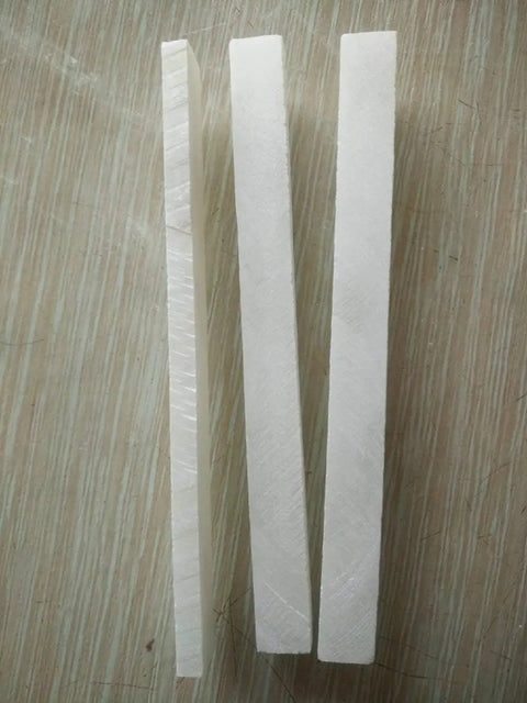 Soapstone Pencils 27 Pack for Welding and Textile Marking, Flat White Stone Refills shown on wooden surface