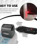 Rock Solid Car Cigarette Lighter Adapter Converts 90 To 240 Volt AC To 12 Volt DC Wall Plug Power Inverter in use near a power strip.