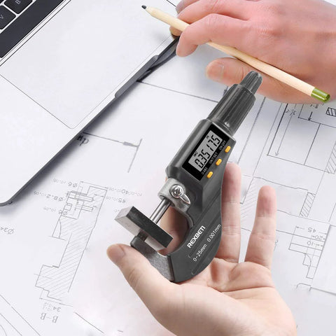 Digital Micrometer For Inch And Metric Measurements With 0 To 1 Inch Range And 0.00005 Inch Or 0.001 mm Resolution in hand with schematics