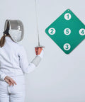 Fencer practicing with Dope Dual Sided Rubber Fencing Training Target Wall Mounted For Indoor And Outdoor Use Lightweight Practice Equipment Epée