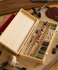 Open wooden box displaying 228 Piece Deluxe Universal Rotary Tool Accessory Kit For Sanding Polishing And Cutting Fits All Rotary Tools