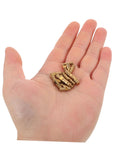 Hand holding brass invisible barrel hinges with quiet operation, 25 pack for jewelry boxes, concealed cylindrical design.