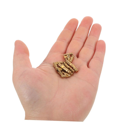 Hand holding set of 25 solid brass concealed barrel hinges for jewelry boxes and small cabinets, hidden cylinder hardware.