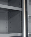 Interior view of deep door bin cabinet with 68 red plastic bins padlockable steel cabinet for tool and parts storage