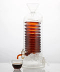 Next Level Glass Cold Brew Coffee Tower Featuring An Adjustable Speed Dripper And Clever Spiral Cooling Tube For Killer Iced Coffee Or Tea Effortlessly with dark coffee and ice