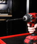 Three Piece Five Sixteenth Inch Magnetic Impact Nut Driver Bit Set, Six Inch Long, installed on a red impact driver.