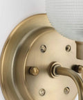 Detail of Archie Collection Clear Double Prismatic Glass Coastal Bath Vanity Light Fixture in Vintage Brass Finish