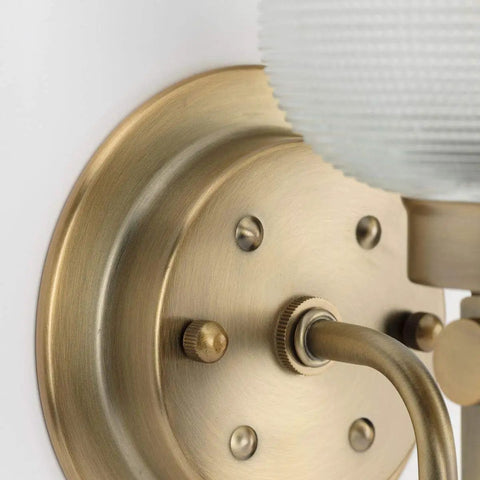 Detail of Archie Collection Clear Double Prismatic Glass Coastal Bath Vanity Light Fixture in Vintage Brass Finish