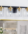 4 Light Modern Vanity Light Fixtures For Bathroom In Matte Black And Brushed Gold With Clear Glass Shades Over Mirror