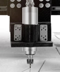 Image of Top Shelf 5.5KW Water Cooled Cnc Spindle Motor 380V 24000Rpm Er25 Chuck mounted on CNC machine for stone engraving.