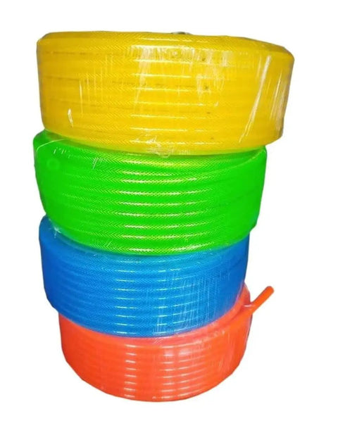 Stack of colorful industrial interchange air hoses with ball coupler, transparent green one for indoor use, 300 PSI, 1/4 in. x 100 ft.