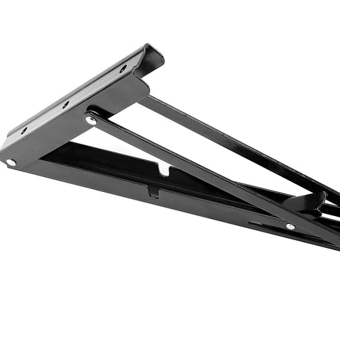 Black metal folding shelf bracket extended, wall-mounted for a workbench.
