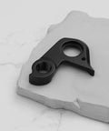 Derailleur Hanger 301092 For BMC Teammachine SLR01 SLR02 SLR03 Disc 2018 2021, black CNC-cut replacement on white surface