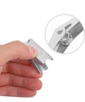 Close-up of hand holding a piece from the 12-Piece Galvanized Steel Toggle Wing Bolts Kit For Drywall Anchors Heavy Duty Expansion Hardware.