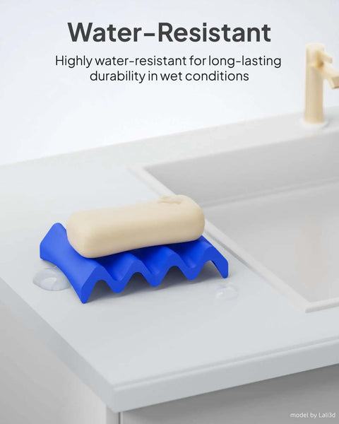 Soap on a blue rippled soap holder on a white sink, highlighting water resistance in wet conditions.