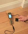 SurveyMaster Dual Function Moisture Meter With Pin And Non Invasive Modes measuring moisture in wooden floor