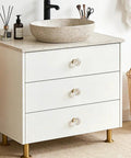 White dresser with 8 Pack Gold Crystal Cabinet Knobs With Screws, Glass Flower Dresser Pulls, in modern bathroom setting.