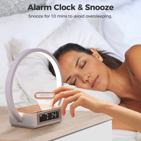 All In One Touch Desk Lamp With Alarm Clock Qi Wireless Charger And Wake Up Light Three Hue Settings Eye Caring LED Reading Bedside Buddy Nightstand Light For Bedroom Living Room, on bedside table next to sleeping person.