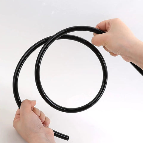 Hands holding black Heavy Duty Nylon Air Line 25ft One Quarter Inch OD Pneumatic Tube DOT Approved SAE J844