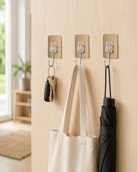 Six Pack Tough Grip Adhesive Wall Hooks Offering No Sweat No Drill Install Slick Gold Square Plate And Clear Hooks hanging keys and a tote.