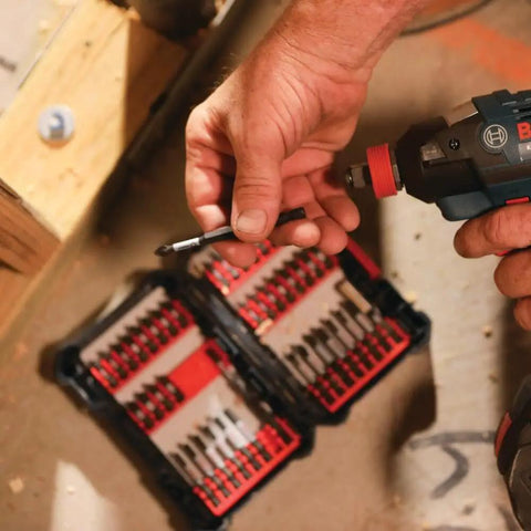 Close-up of hand using a drill with a bit from the 44 Piece Impact Tough Screwdriver Bit Set in Custom Case System with Xtended Torsion Zone