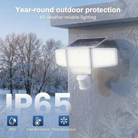 SZPOWER 6000LM Motion Sensor Outdoor Lights, 4 Heads 3 Modes Solar Flood Lights Outdoor mounted on a frosty wall, IP65 rated.