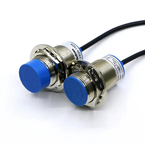 Go-To Proximity Sensor FR30-15DC With Cable For Motion Detection And Photoelectric Sensing Industrial Automation Ready Rugged Build Easy Install High Reliability Ideal For Conveyor Systems And Safety Interlocks, two blue-capped metal sensors