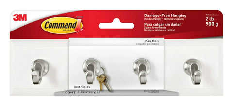 Quartz Key Rail For Damage Free Wall Organization No Drill Mount displayed in packaging with hooks visible.