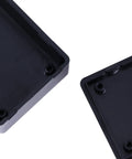 Close-up of Six Pack Abs Plastic Junction Boxes for Diy Electronics Projects, measuring 2.8 x 1.7 x 0.9 inches, black ABS material.