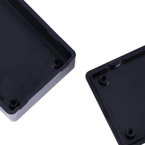 Close-up of Six Pack Abs Plastic Junction Boxes for Diy Electronics Projects, measuring 2.8 x 1.7 x 0.9 inches, black ABS material.
