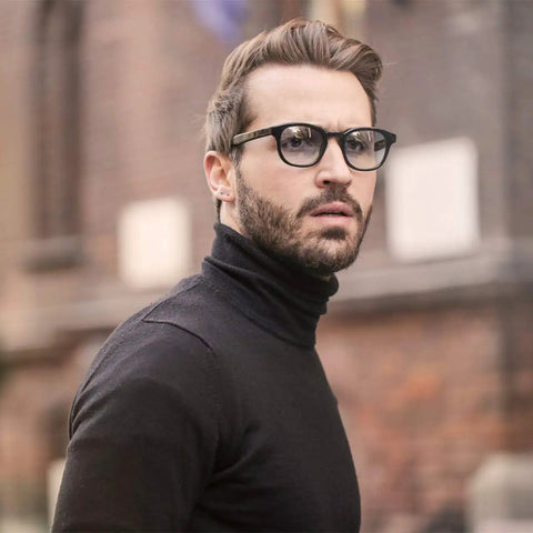 Silver Stainless Steel Ball Stud Earrings Set For Women And Men Hypoallergenic 10 Pcs 3mm To 8mm Round Ball Stud Earrings Classic Minimalist Jewelry For Everyday Wear on man with black turtleneck and glasses