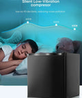 One Point One Cubic Foot Compact Countertop Mini Freezer with silent low-vibration compressor beside a sleeping child.