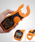 Hand holding Digital Clamp Multimeter With Large LCD Display For AC And DC Voltage Current And Resistance Testing Handy Workhorse Clamp Tester