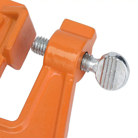 Close-up of Portable Compact 5.1 Inch Chain Filing Vise With Dual Lock System for chainsaw sharpening in woodworking and forestry.