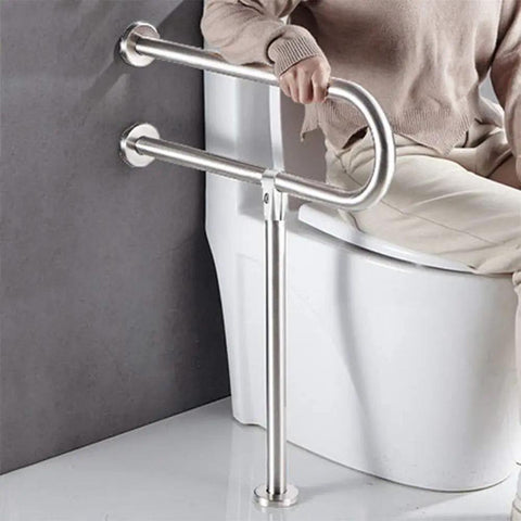 Sturdy 23.6 Inch Stainless Steel Handicap Toilet Grab Bar With T Shape Mount For Bathroom Safety Rails Wall And Floor Install No Slip Grip Ideal For Seniors And Elderly Bath Assistance Supports Up To Four Hundred Forty Pounds in use next to a toilet.