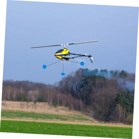 Three Set RC Helicopter Training Kit With Sponge Foam for Airplanes and Helis in flight over grassy field
